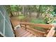 Exterior wooden staircase and railings descending toward the natural backyard setting at 2765 Rue Sans Famille, Raleigh, NC 27607