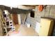 Unfinished basement storage and utility area with concrete block walls and shelving at 2765 Rue Sans Famille, Raleigh, NC 27607