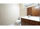 Standard bathroom with toilet, mirror, and a wooden vanity with cabinets and drawers at 2765 Rue Sans Famille, Raleigh, NC 27607