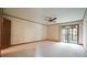Large bedroom featuring carpet, ceiling fan, and sliding glass doors to the outside at 2765 Rue Sans Famille, Raleigh, NC 27607