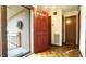 Inviting home entrance with a vibrant red door and ramp access for easy entry at 2765 Rue Sans Famille, Raleigh, NC 27607