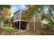 Exterior view of a house with a screened-in porch and stairs leading to a deck at 2765 Rue Sans Famille, Raleigh, NC 27607