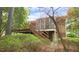 Exterior shot of a back porch and deck behind lush landscaping at 2765 Rue Sans Famille, Raleigh, NC 27607