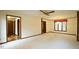 Large living room with a fireplace, neutral carpet, and plenty of natural light at 2765 Rue Sans Famille, Raleigh, NC 27607