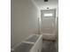 Unfinished bathroom with a partially covered tub and small window at 28 Bailey-Boykin Rd, Selma, NC 27576