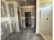 Bathroom under construction with plumbing, a walk-in shower, and a door to a closet at 28 Bailey-Boykin Rd, Selma, NC 27576