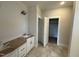 Bathroom with white cabinetry and modern fixtures, conveniently located next to a closet at 28 Bailey-Boykin Rd, Selma, NC 27576