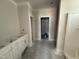 Unfinished bathroom with white cabinets and an adjacent walk-in closet at 28 Bailey-Boykin Rd, Selma, NC 27576