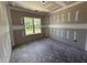 Bedroom under construction with window looking out to the front yard at 28 Bailey-Boykin Rd, Selma, NC 27576
