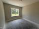 Bedroom featuring a window, neutral paint, and white trim at 28 Bailey-Boykin Rd, Selma, NC 27576