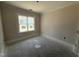 Unfinished bedroom with neutral paint and a bright window at 28 Bailey-Boykin Rd, Selma, NC 27576