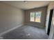 Bedroom featuring a bright window, neutral paint, and white trim at 28 Bailey-Boykin Rd, Selma, NC 27576