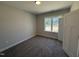 Comfortable bedroom with neutral carpeting, a bright window, and ample natural light at 28 Bailey-Boykin Rd, Selma, NC 27576