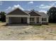 Charming single-story home featuring a large, attached two-car garage and inviting front porch at 28 Bailey-Boykin Rd, Selma, NC 27576