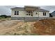 New construction home with covered porch, siding, and a large yard ready for landscaping at 28 Bailey-Boykin Rd, Selma, NC 27576