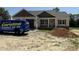 Inviting single-Gathering home featuring a partial stone facade, covered porch, and attached garage at 28 Bailey-Boykin Rd, Selma, NC 27576