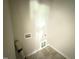 Bright laundry room featuring tile floors and hookups at 28 Bailey-Boykin Rd, Selma, NC 27576