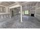 Bright living room under construction with fireplace, large windows and open floorplan at 28 Bailey-Boykin Rd, Selma, NC 27576