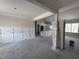 Unfinished living room with wainscoting details and an open floor plan to the kitchen with natural light at 28 Bailey-Boykin Rd, Selma, NC 27576