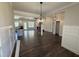 Open-concept living room boasts hardwood floors, recessed lighting and stylish fixtures at 28 Bailey-Boykin Rd, Selma, NC 27576