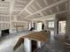 Unfinished living room boasts a modern fireplace, white cabinets and an open design ready for customization at 28 Bailey-Boykin Rd, Selma, NC 27576