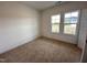 Bedroom with neutral carpeting, natural light, and views of the neighborhood at 282 Trescott St, Smithfield, NC 27577