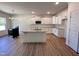 Bright kitchen with an island, granite countertops, stainless steel appliances, and ample cabinet space at 282 Trescott St, Smithfield, NC 27577