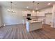 Modern kitchen featuring granite countertops, stainless steel appliances, a large island, and ample cabinet space at 282 Trescott St, Smithfield, NC 27577