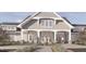 Charming exterior view featuring a light gray facade, inviting entrance, and lush landscaping at 815 Central Park Dr, Knightdale, NC 27604