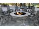 Cozy community fire pit with Adirondack chairs encircling a stone fire pit, perfect for gatherings at 815 Central Park Dr, Knightdale, NC 27604