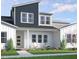 Beautiful two-story home featuring modern architecture, lush landscaping, and a welcoming front porch at 815 Central Park Dr, Knightdale, NC 27604