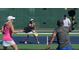 Active pickleball court with players enjoying a competitive game and a green screen background at 815 Central Park Dr, Knightdale, NC 27604