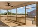 Enjoy outdoor living on this back porch with ceiling fan and wooded view at 30 Tee Dr, Selma, NC 27576