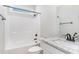 Bright bathroom features a shower-tub combination and granite countertop at 30 Tee Dr, Selma, NC 27576
