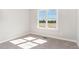 Comfortable bedroom with natural light, carpeted floor, and simple design at 30 Tee Dr, Selma, NC 27576