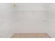 Walk-in closet featuring carpeted floors and white wire shelving at 30 Tee Dr, Selma, NC 27576