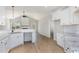 Open kitchen features white cabinets, breakfast bar, and seamless flow to living area at 30 Tee Dr, Selma, NC 27576