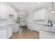 Well-lit kitchen showcases white cabinets, modern appliances, and stylish design at 30 Tee Dr, Selma, NC 27576