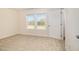 Neutral bedroom with a window letting in natural light and neutral carpet at 300 Tuscany Cir, Princeton, NC 27569