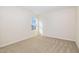 Neutral bedroom with a window letting in natural light and neutral carpet at 300 Tuscany Cir, Princeton, NC 27569