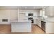 Beautiful kitchen featuring a spacious island, stainless steel appliances, and white cabinets at 300 Tuscany Cir, Princeton, NC 27569
