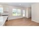 Bright kitchen with a white cabinets, an eat-in area, and a back door for easy access at 300 Tuscany Cir, Princeton, NC 27569