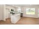 Bright kitchen featuring white cabinets, stainless steel appliances, and a stylish island at 300 Tuscany Cir, Princeton, NC 27569