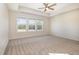 Expansive main bedroom featuring neutral carpeting, ample natural light, and a tray ceiling at 300 Tuscany Cir, Princeton, NC 27569