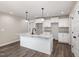 Modern kitchen island featuring granite countertops, a stylish faucet, and ample storage space at 303 E Pope Ave, Kenly, NC 27542
