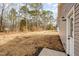 Expansive backyard features a mix of open space and trees, offering privacy and room for outdoor activities at 307 E Pope Ave, Kenly, NC 27542