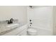 A bathroom showcasing granite countertops, sleek black faucets and a shower/tub at 307 E Pope Ave, Kenly, NC 27542
