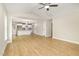 Open-concept living space with hardwood flooring seamlessly flowing into the modern kitchen at 307 E Pope Ave, Kenly, NC 27542