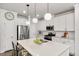 Gourmet kitchen with stainless steel appliances, island seating, and ample counter space at 309 Millennium Dr, Pittsboro, NC 27312