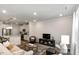 Inviting living room with hardwood floors, recessed lighting, and an open flow into the kitchen area at 309 Millennium Dr, Pittsboro, NC 27312